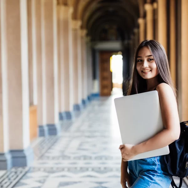 Indian student standing in a university hallway, representing 2025 student visa Australia updates and study opportunities.