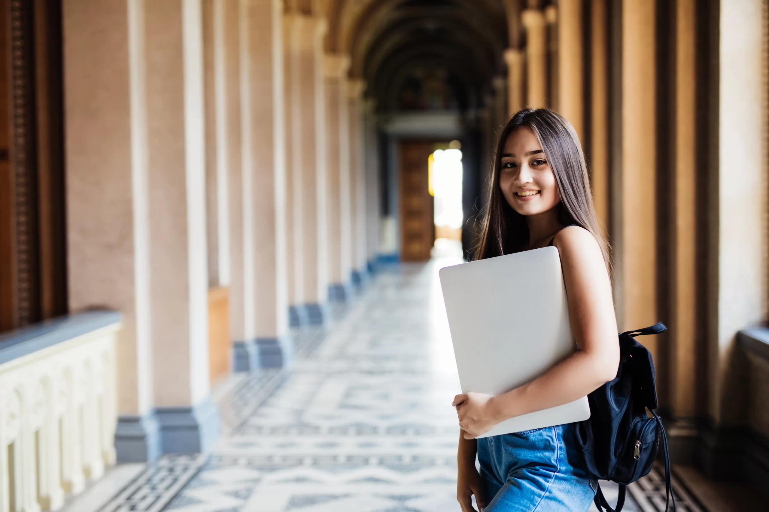 Indian student standing in a university hallway, representing 2025 student visa Australia updates and study opportunities.